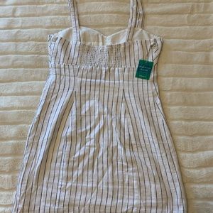 White dress with black stripes.